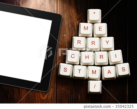 Christmas tree made of computer keys and tablet Christmas tree made of computer keys and tablet 35042325