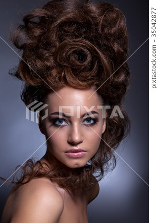 Portrait of a beautiful girl with a creative high hairstyle and Portrait of a beautiful girl with a creative high hairstyle and 35042877