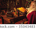 Santa Claus writes naughty or nice Christmas list 35043483