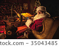 Santa Claus uses smart phone at North Pole 35043485