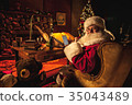 Santa in workshop, excited about using technology 35043489