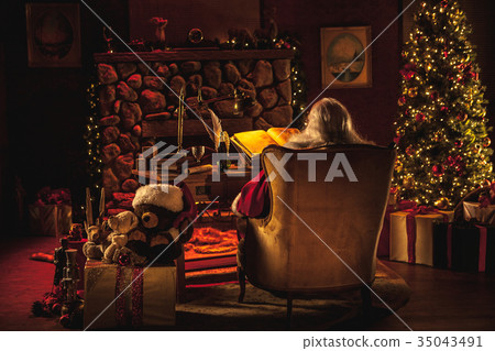 Santa Claus sitting in workshop, wide shot Santa Claus sitting in workshop, wide shot 35043491