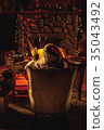 Santa relaxing at North Pole portrait from behind 35043492