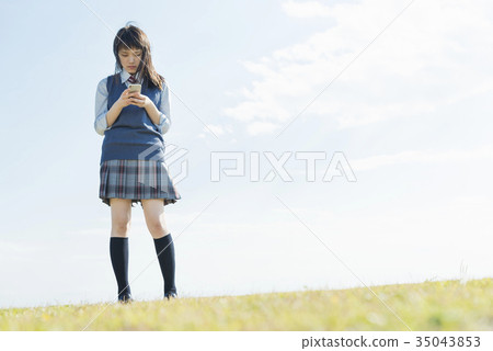 High school girl meadow smartphone High school girl meadow smartphone 35043853