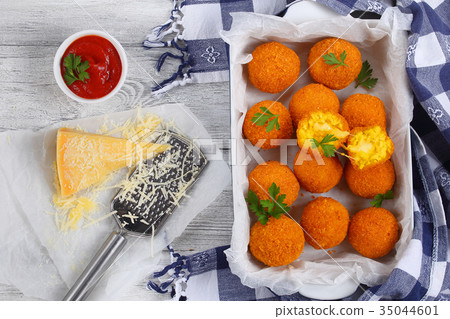 saffron rice balls stuffed with cheese 35044601