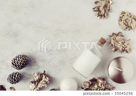 Fall beauty products flatlay on white marble 35045256