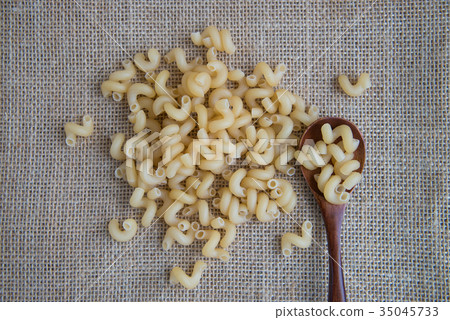 Cavatappi raw pasta on rustic background . Natural 35045733