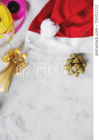 Christmas gifts preparation on white marble table Christmas gifts preparation on white marble table 35051112