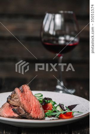 Grilled beefsteak with glass of red wine Grilled beefsteak with glass of red wine 35051574