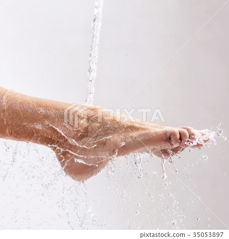 Sensual woman's legs in clean water splashes. 35053897