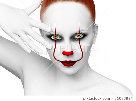 Redhead woman with scary clown grimm. Redhead woman with scary clown grimm. 35053984