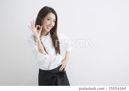  A woman who is upset with a hand sign 35054164