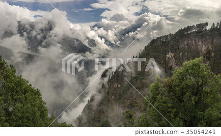Nilgiri summit and cloudy Himalayas 35054241