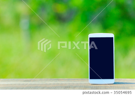 Smartphone and green background 35054695