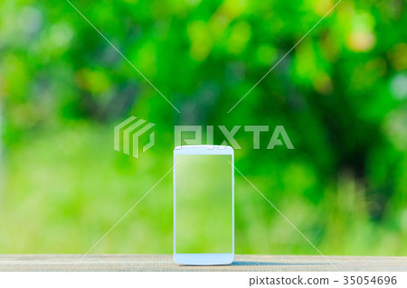 Smartphone and green background 35054696