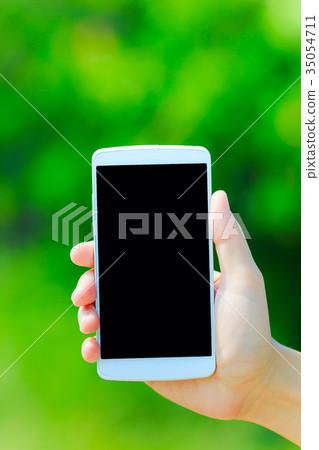 Smartphone and green background 35054711