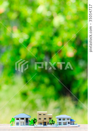 House model and green blur background - Stock Photo [35054717] - PIXTA