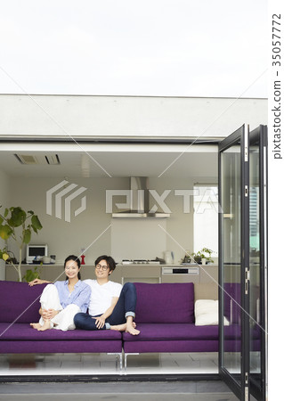 A couple relaxing in the living room 35057772