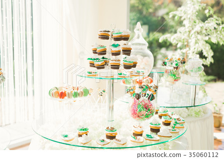 Delicious sweets on wedding candy buffet with 35060112