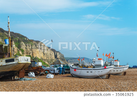Fishing boats on the shore, pebble beach Fishing boats on the shore, pebble beach 35061925