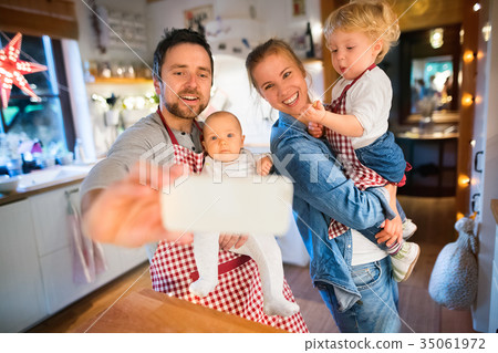 Young family making cookies at home. Young family making cookies at home. 35061972