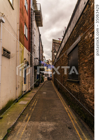 Narrow passage from the back of buildings Narrow passage from the back of buildings 35063429