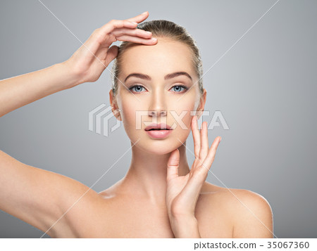 Beautiful face of young woman with perfect skin Beautiful face of young woman with perfect skin 35067360