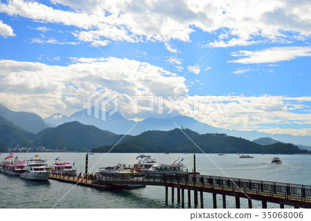 Scenery lake cloud boat mountain Taiwan sun moon lake pier deck sky lake water activity tourism leisure leisure activity sunny 35068006