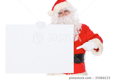 Santa Claus pointing on blank white wall Santa Claus pointing on blank white wall 35068215