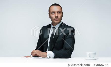 The attractive man in black suit on white 35068786