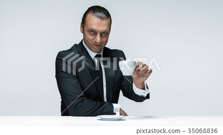 The attractive man in black suit on white 35068836