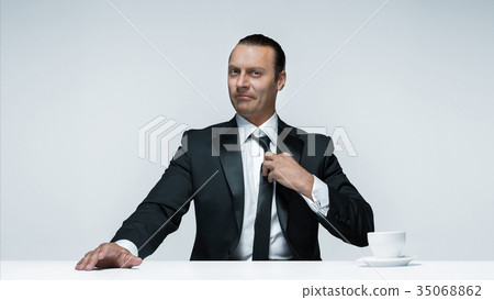 The attractive man in black suit on white 35068862