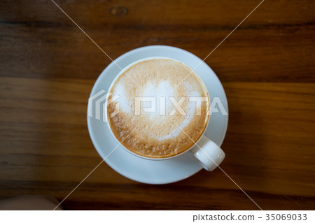 Hot coffee cup on wooden table Hot coffee cup on wooden table 35069033