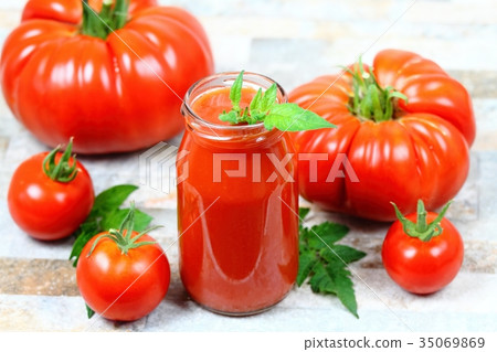 Homemade preserved ketchup from giant tomatoes  35069869
