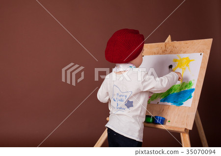 little boy artist brush and paints paints a 35070094