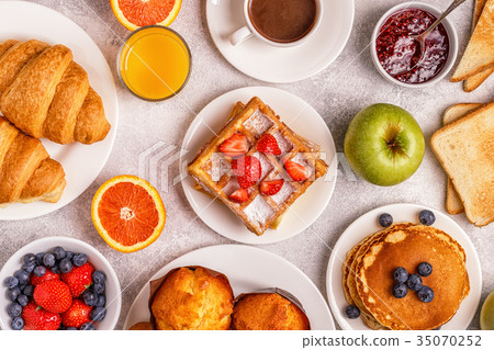 Delicious breakfast on a light table. 35070252