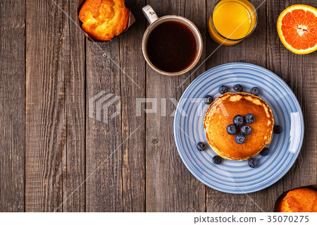 Delicious breakfast on a rustic table. Delicious breakfast on a rustic table. 35070275