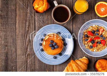 Delicious breakfast on a rustic table. Delicious breakfast on a rustic table. 35070276