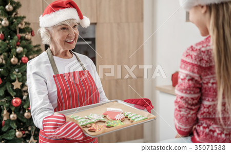 Generous grandmother giving to child self-made 35071588