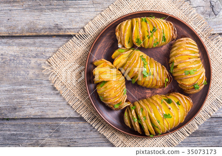 Freshly baked hasselback potatoes 35073173