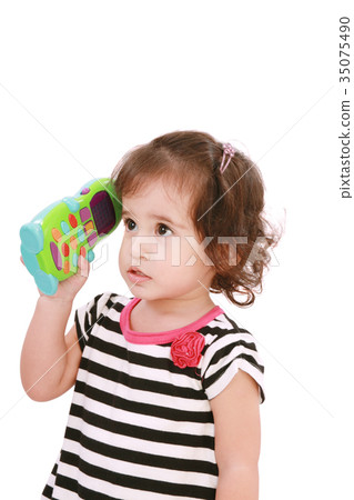 cute little girl in dress calling by telephone 35075490