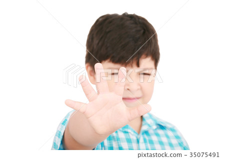 Child looking at camera. Stop signal with his hand 35075491
