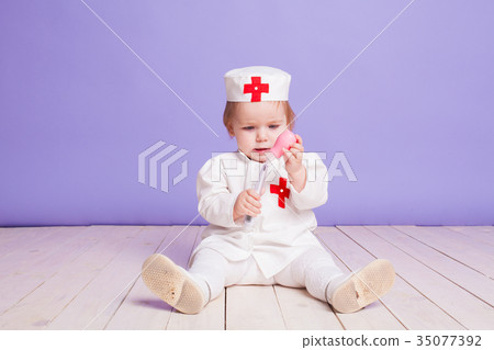 little girl dressed as a doctor plays in hospital little girl dressed as a doctor plays in hospital 35077392