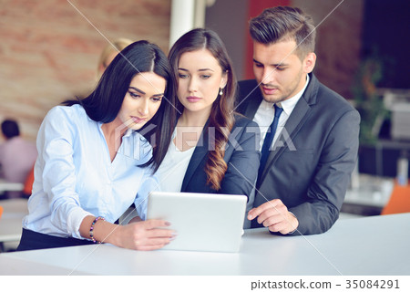 Teamwork process concept.Young coworkers work with Teamwork process concept.Young coworkers work with 35084291