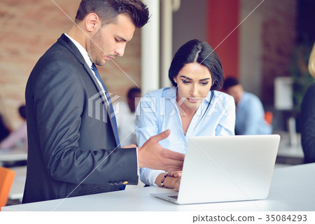 Teamwork process concept.Young coworkers work with Teamwork process concept.Young coworkers work with 35084293
