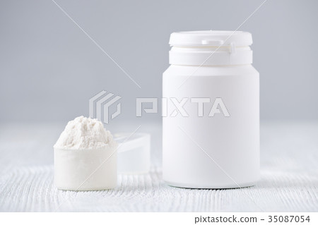 mock up bottle and a spoon with powder, selective 35087054