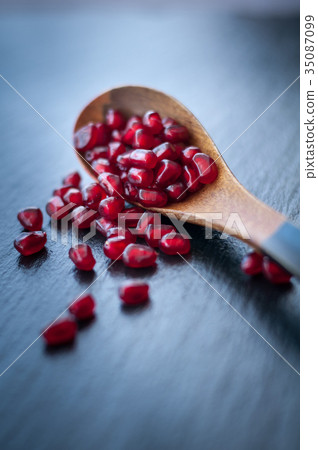 fresh pomegranate on a black background 35087099