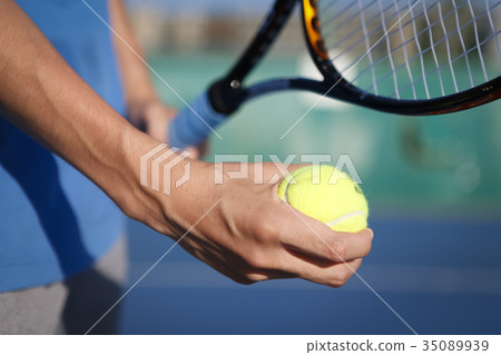 The man's hand playing tennis The man's hand playing tennis 35089939