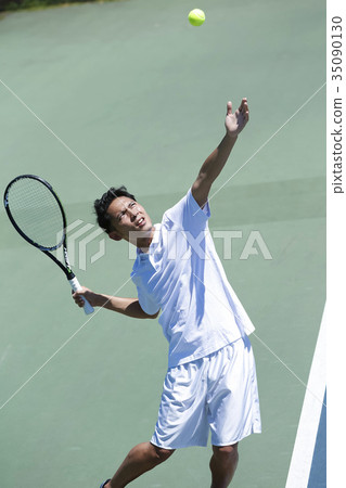 A man playing tennis A man playing tennis 35090130