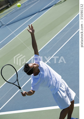 A man playing tennis A man playing tennis 35090132